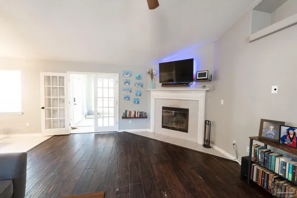 a bedroom with bed and a chandelier