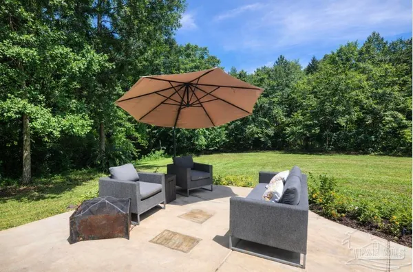 a view of a house with garden and yard