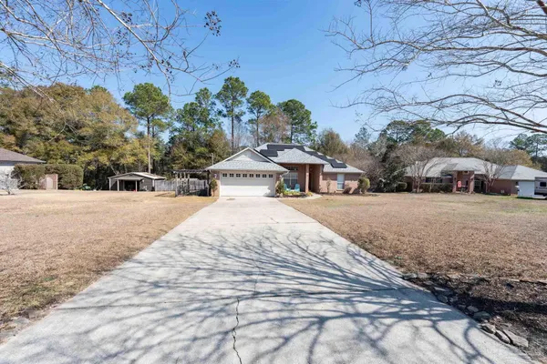 a small pool with some trees in the background