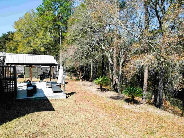 a view of a yard covered in snow