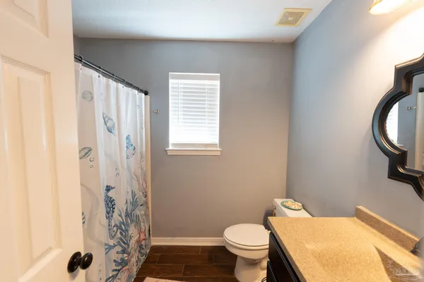 a bedroom with furniture and a window