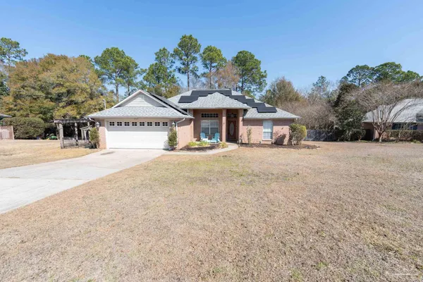 a kitchen with stainless steel appliances granite countertop a stove a sink and white cabinets