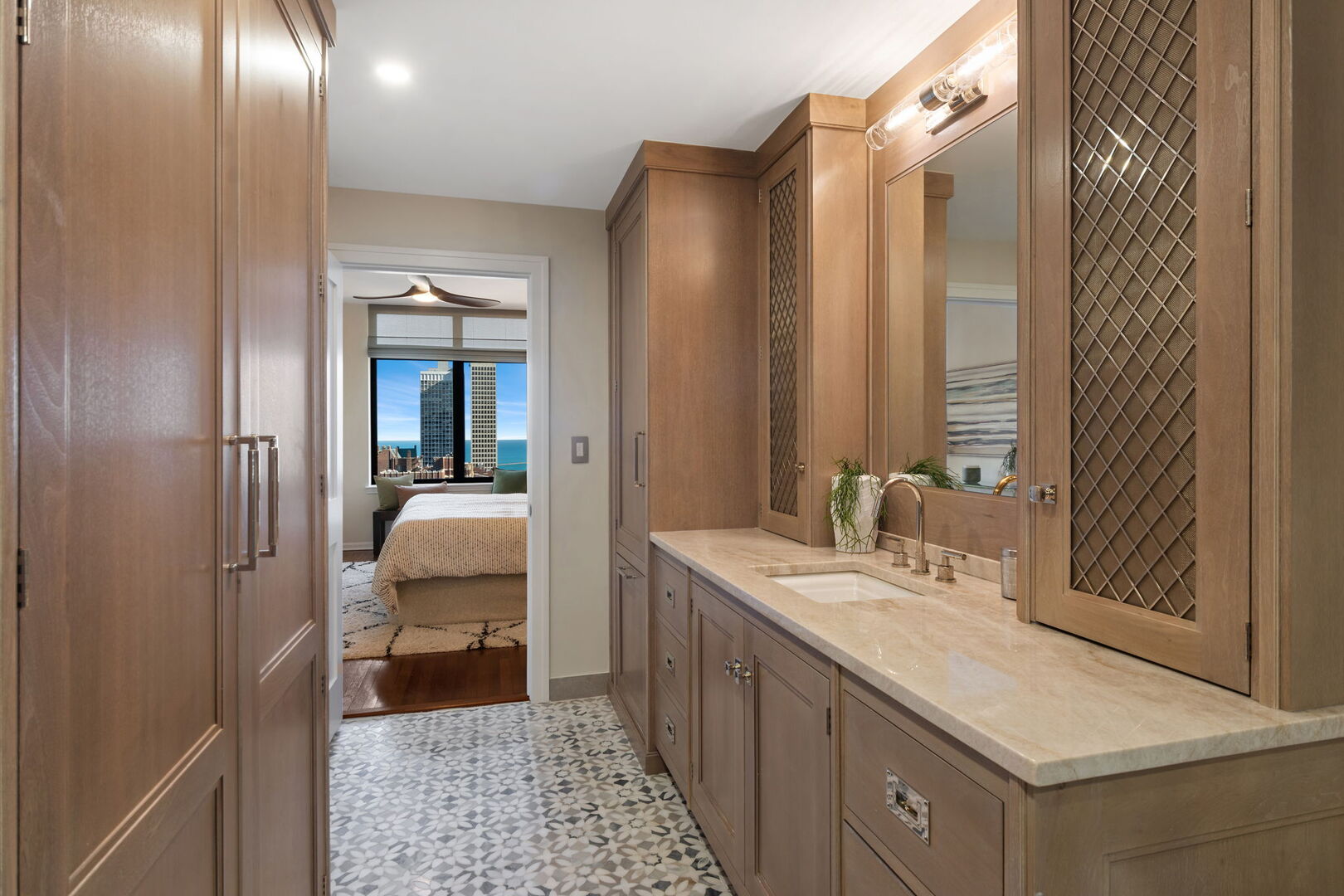 1122 North Dearborn Street, Unit 25H Chicago, IL 60610 - Photo 12 of 30 a en suite bathroom with a sink and a mirror