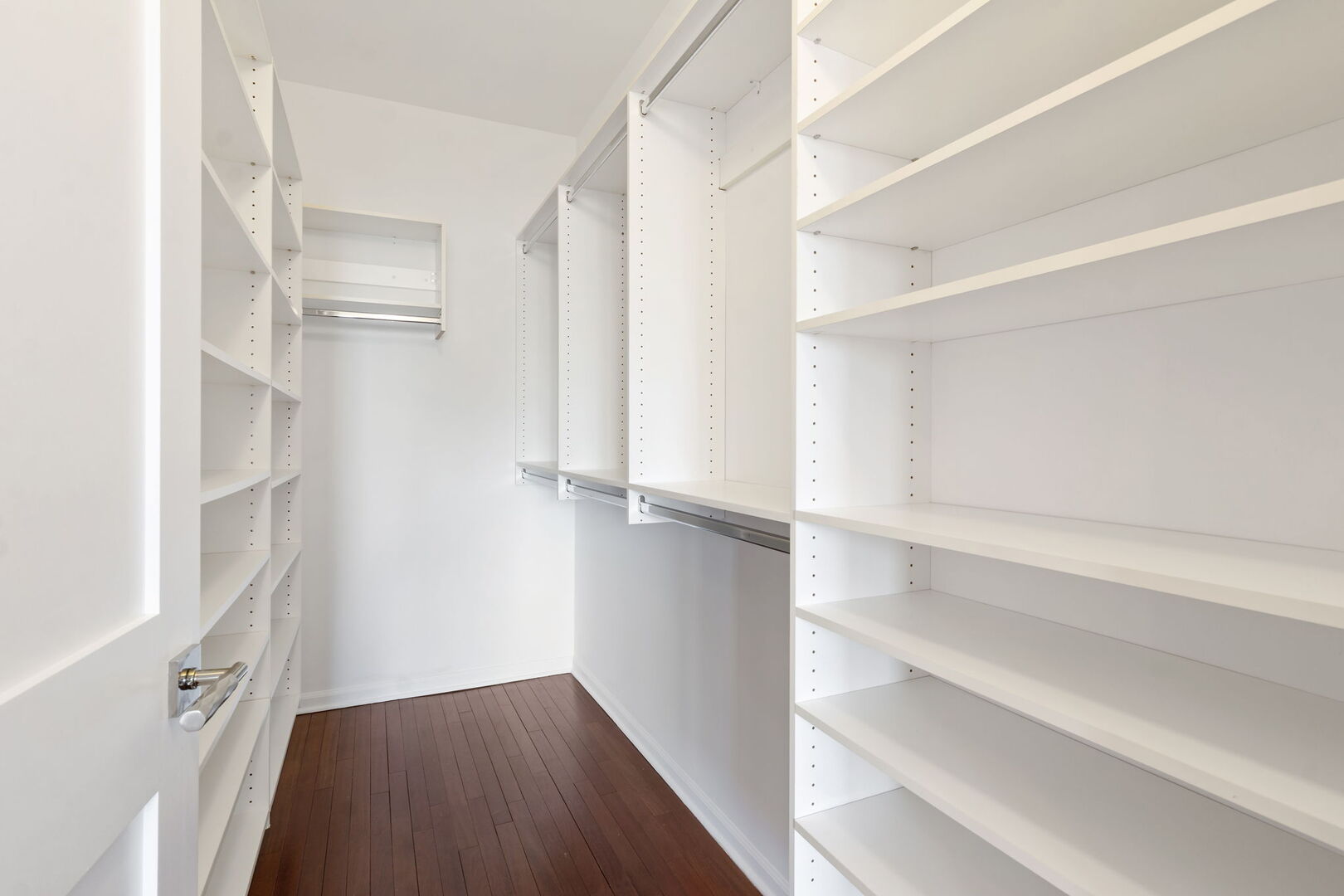 1122 North Dearborn Street, Unit 25H Chicago, IL 60610 - Photo 13 of 30 a view of walk in closet with empty racks