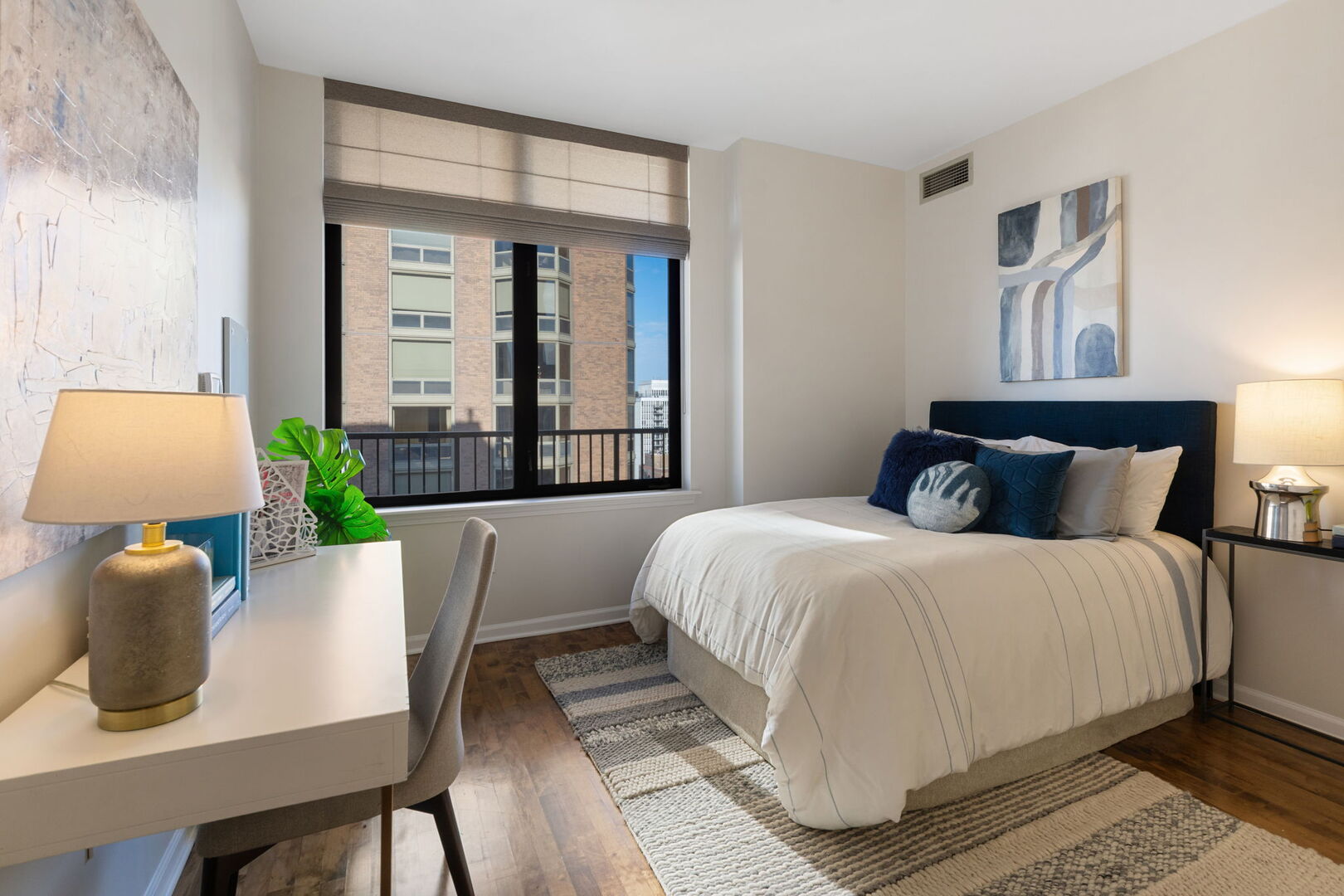 1122 North Dearborn Street, Unit 25H Chicago, IL 60610 - Photo 14 of 30 a bedroom with a bed and window