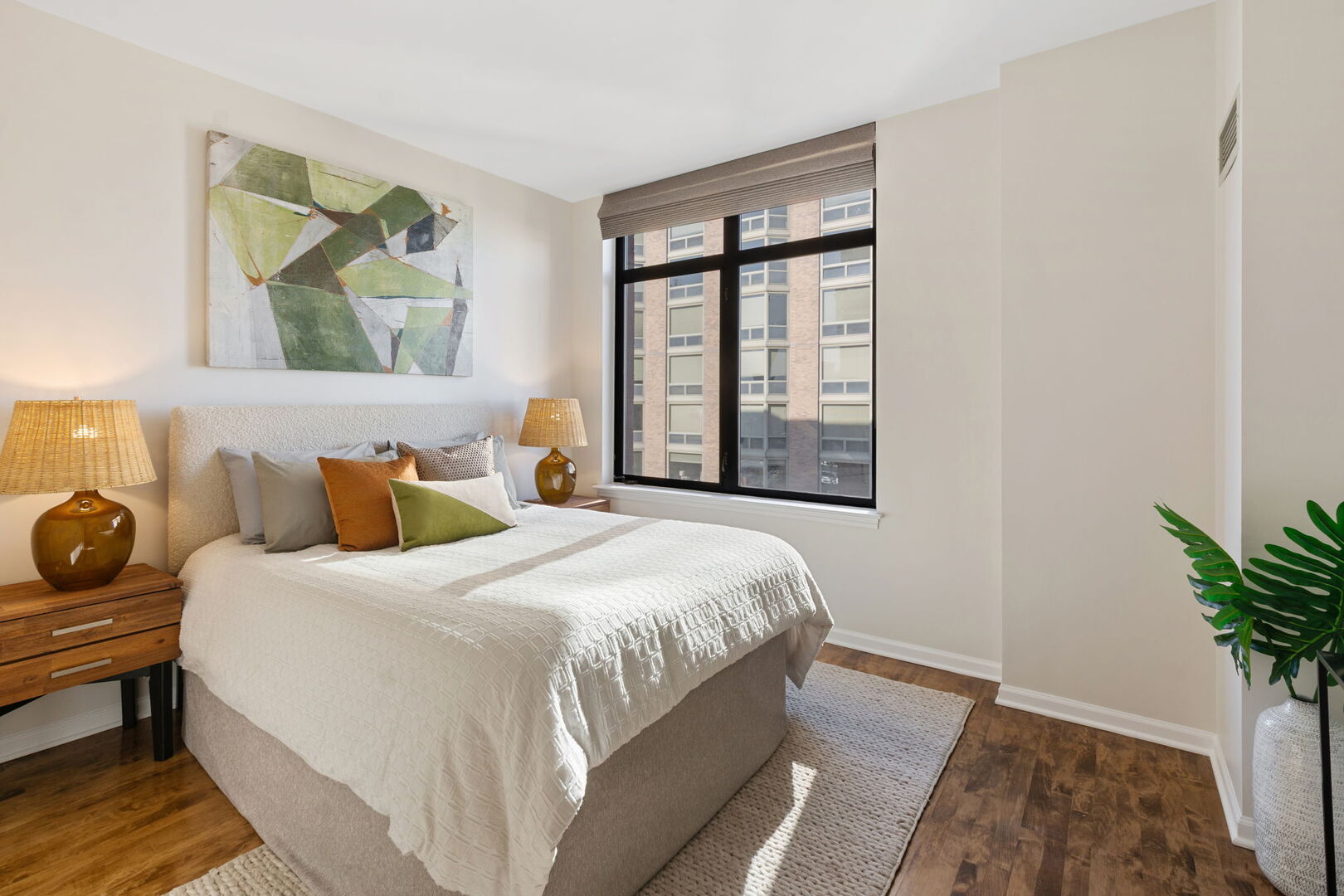 1122 North Dearborn Street, Unit 25H Chicago, IL 60610 - Photo 15 of 30 a bedroom with a bed and a window