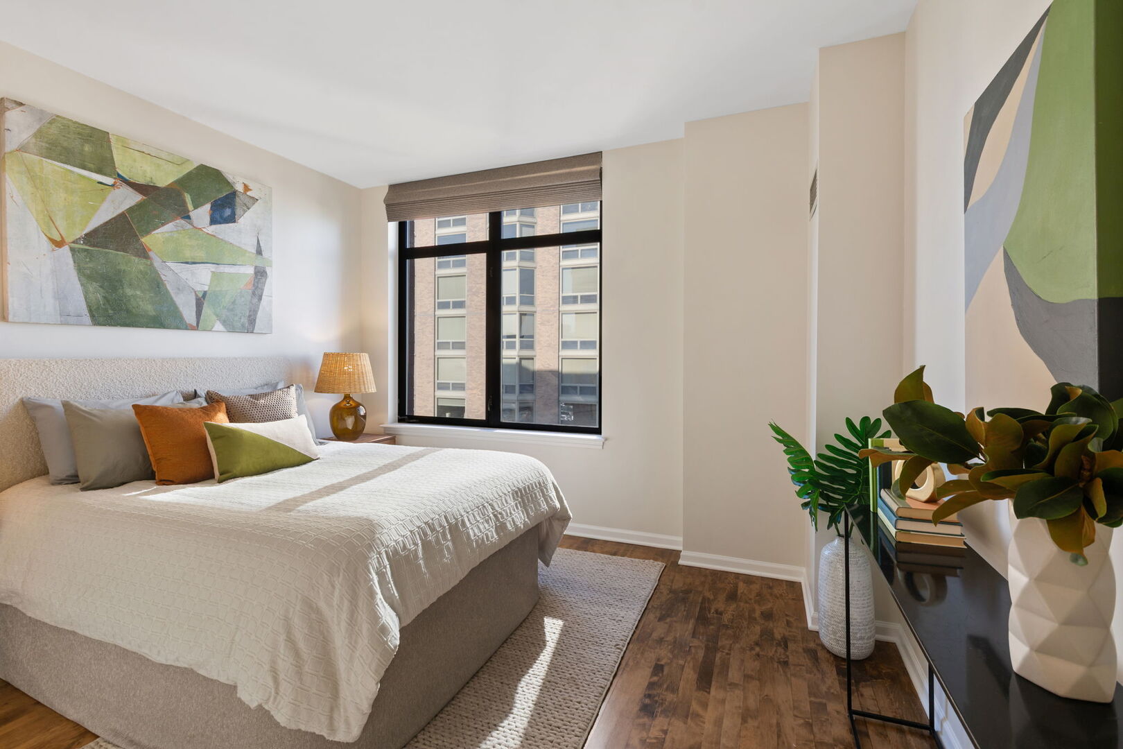 1122 North Dearborn Street, Unit 25H Chicago, IL 60610 - Photo 16 of 30 a bedroom with bed and a window