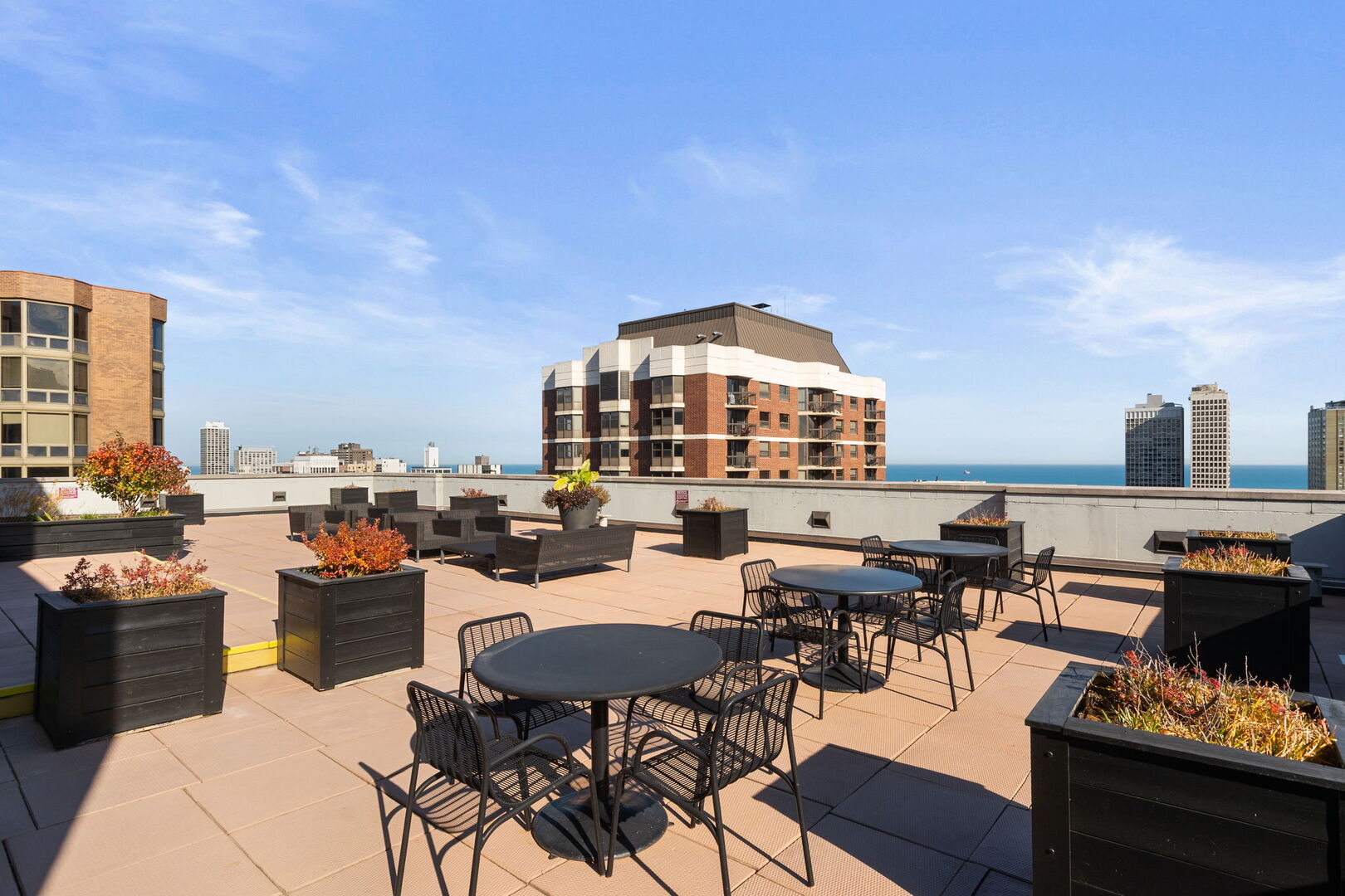 1122 North Dearborn Street, Unit 25H Chicago, IL 60610 - Photo 24 of 30 a view of a terrace with furniture and a kitchen