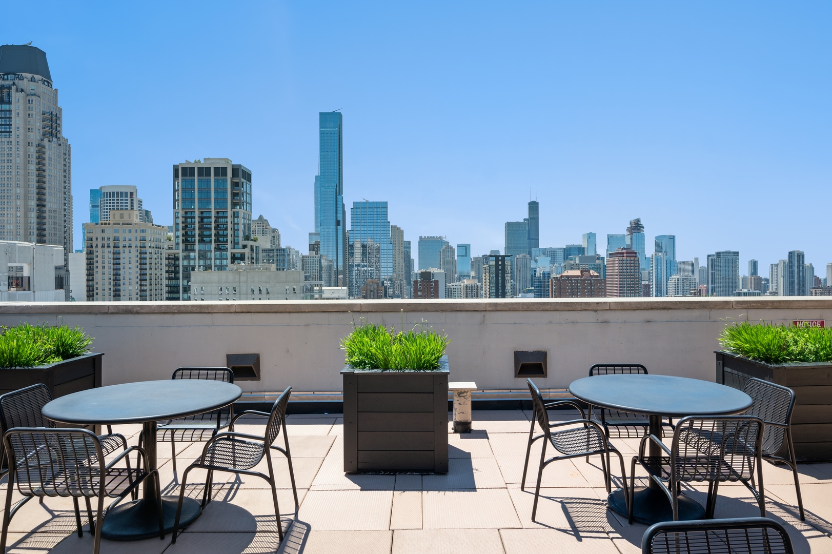 1122 North Dearborn Street, Unit 25H Chicago, IL 60610 - Photo 30 of 30 a view of a chairs and table on the terrace