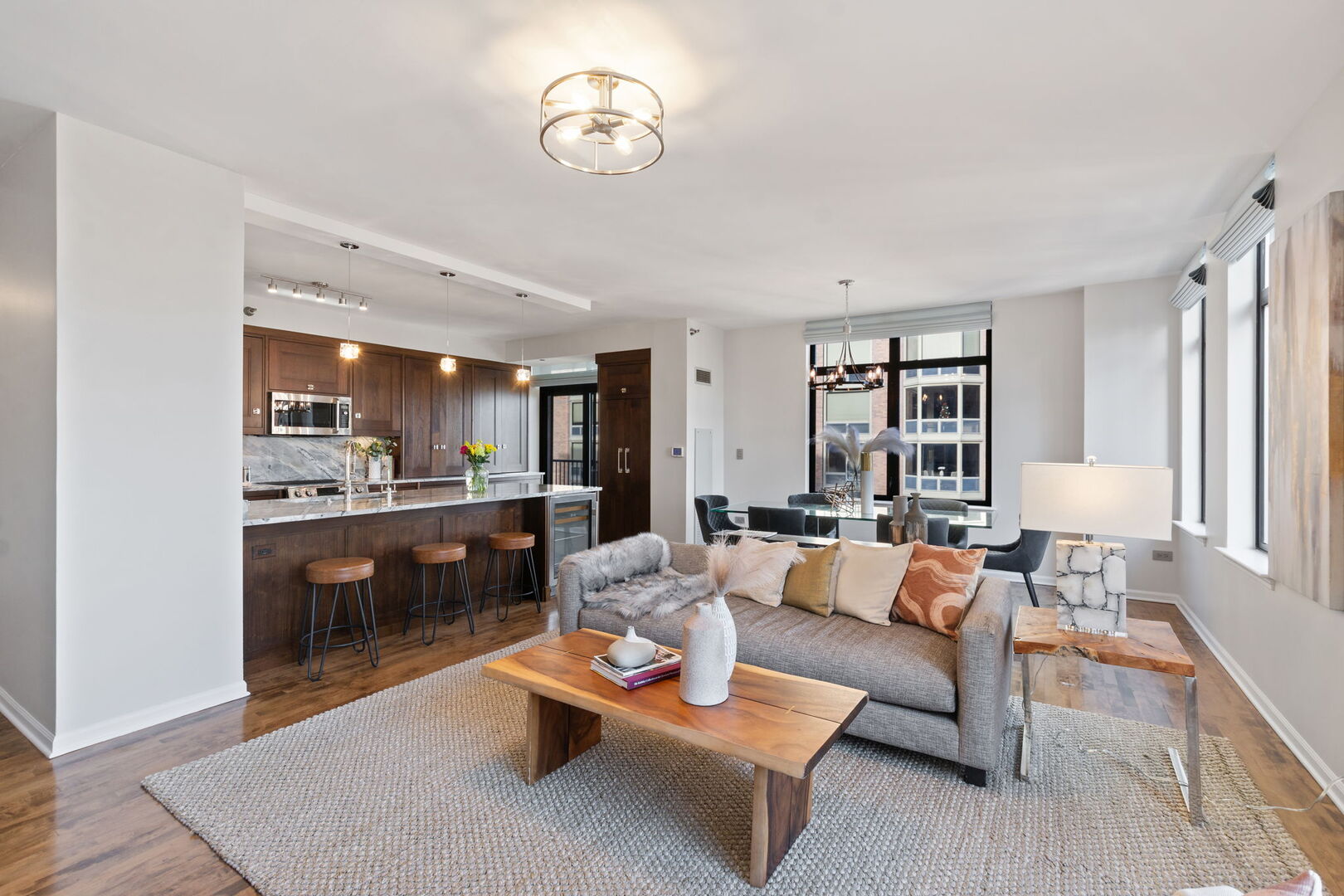 1122 North Dearborn Street, Unit 25H Chicago, IL 60610 - Photo 3 of 30 a living room with furniture kitchen view and a table