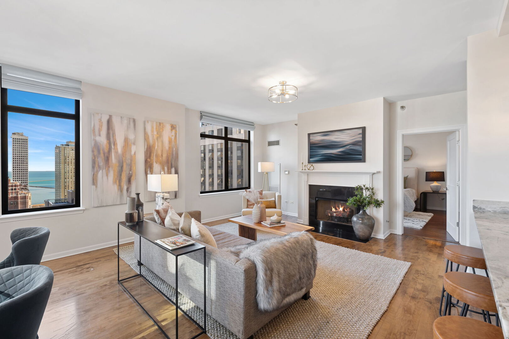 1122 North Dearborn Street, Unit 25H Chicago, IL 60610 - Photo 5 of 30 a living room with furniture and a fireplace
