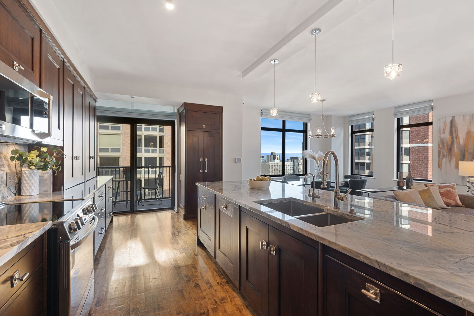 1122 North Dearborn Street, Unit 25H Chicago, IL 60610 - Photo 7 of 30 a large kitchen with granite countertop a large counter top appliances and cabinets