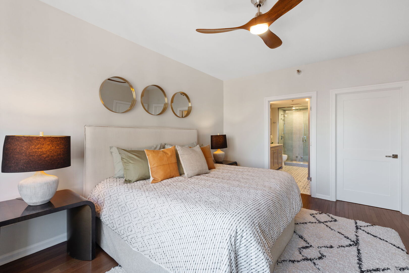 1122 North Dearborn Street, Unit 25H Chicago, IL 60610 - Photo 10 of 30 a bedroom with a bed and painting on the wall