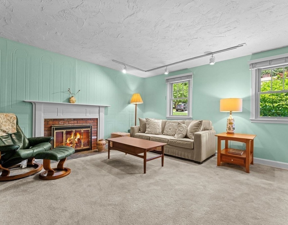 9 Pleasantview Terrace Framingham, MA 01701 - Photo 15 of 35 a living room with furniture and a fireplace