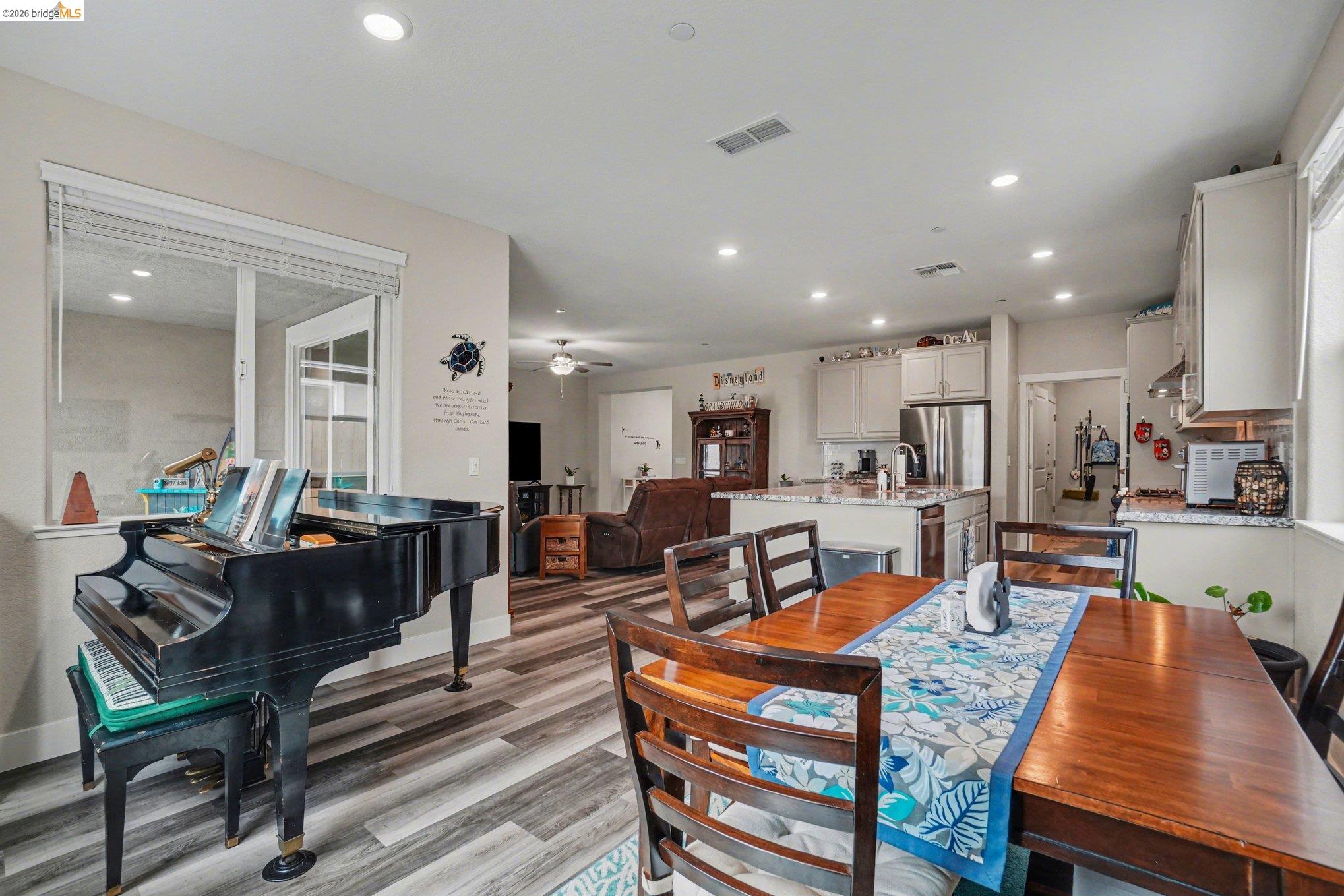 4585 Prairie Path Rio Vista, CA 94571 - Photo 11 of 45 a living room with furniture a red lamp and a table