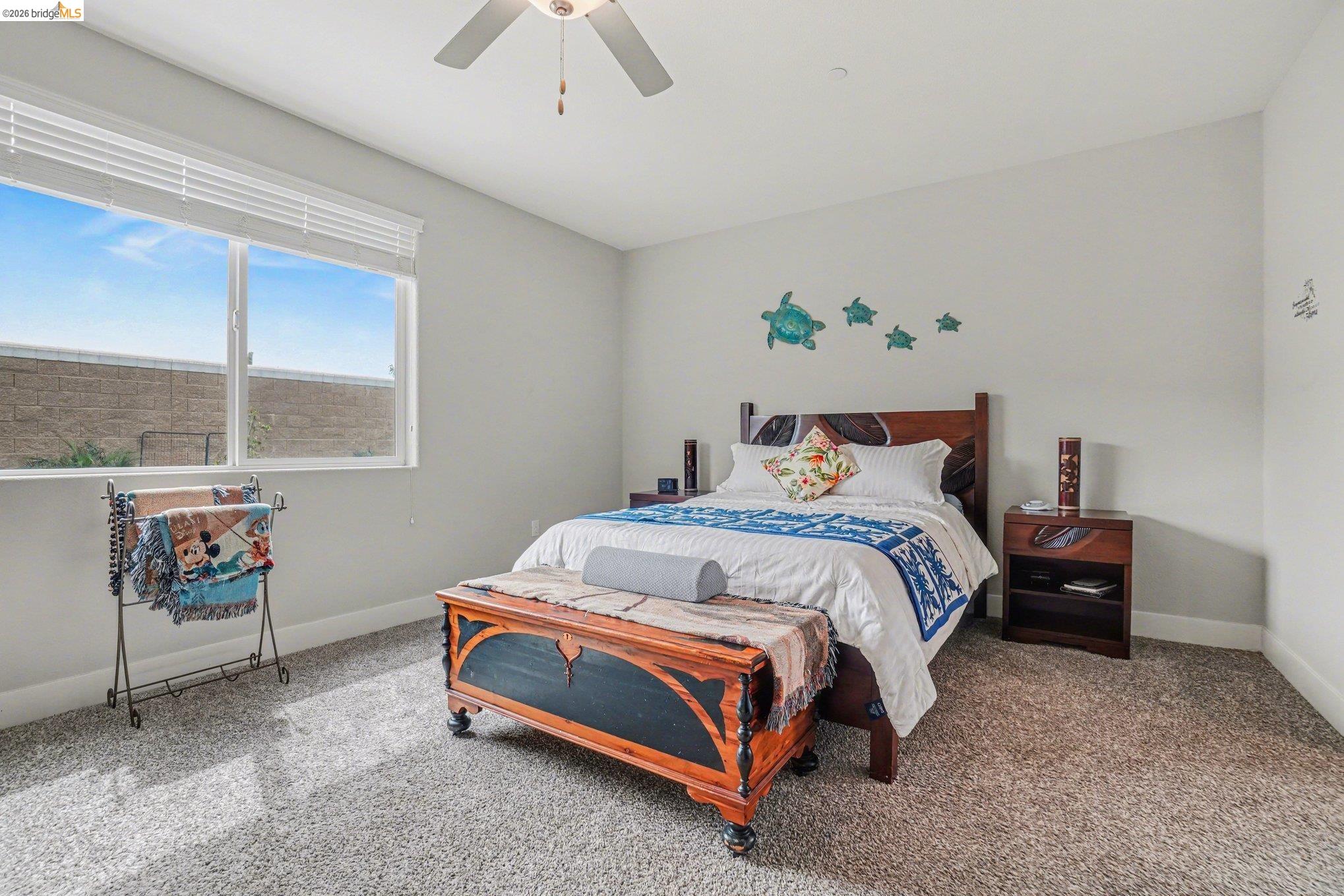 4585 Prairie Path Rio Vista, CA 94571 - Photo 13 of 45 a bedroom with a bed and window