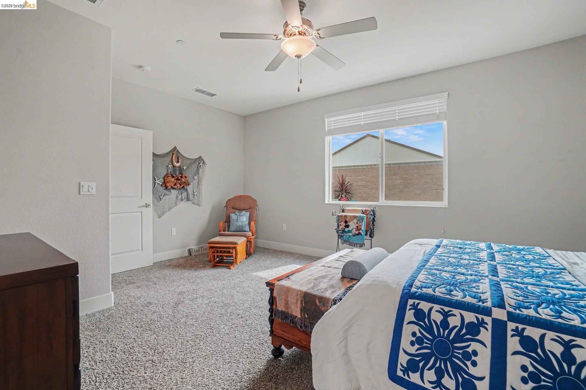 4585 Prairie Path Rio Vista, CA 94571 - Photo 14 of 45 a bedroom with a bed and a chandelier