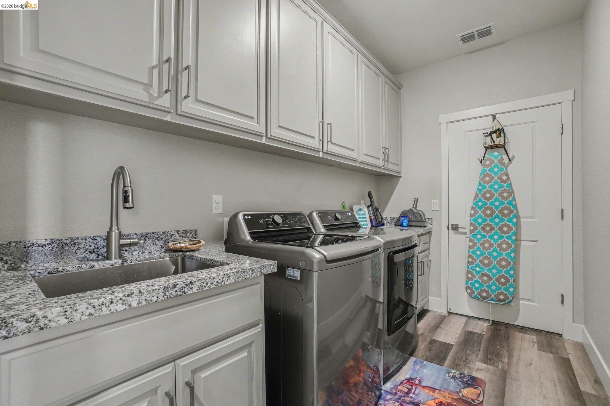 4585 Prairie Path Rio Vista, CA 94571 - Photo 20 of 45 a kitchen with stainless steel appliances granite countertop a sink stove and cabinets