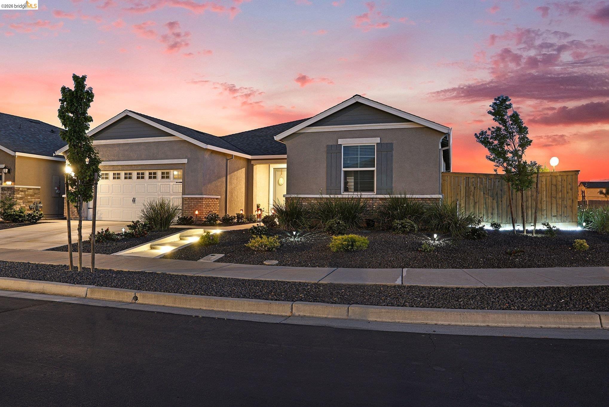 4585 Prairie Path Rio Vista, CA 94571 - Photo 2 of 45 a front view of a house with a yard and a garage