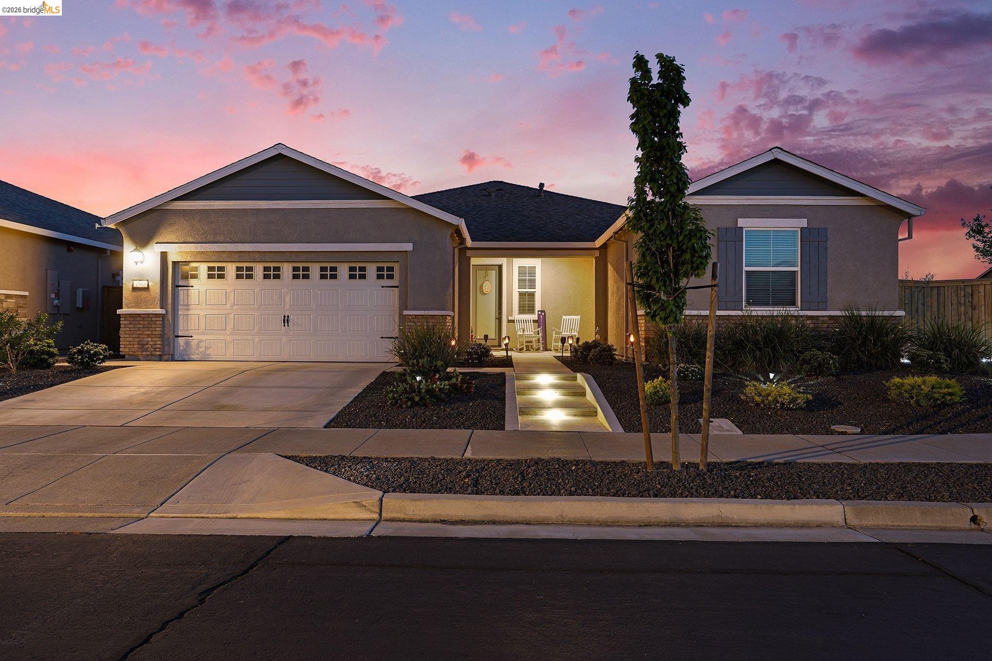 4585 Prairie Path Rio Vista, CA 94571 - Photo 3 of 45 a front view of a house with a yard and garage