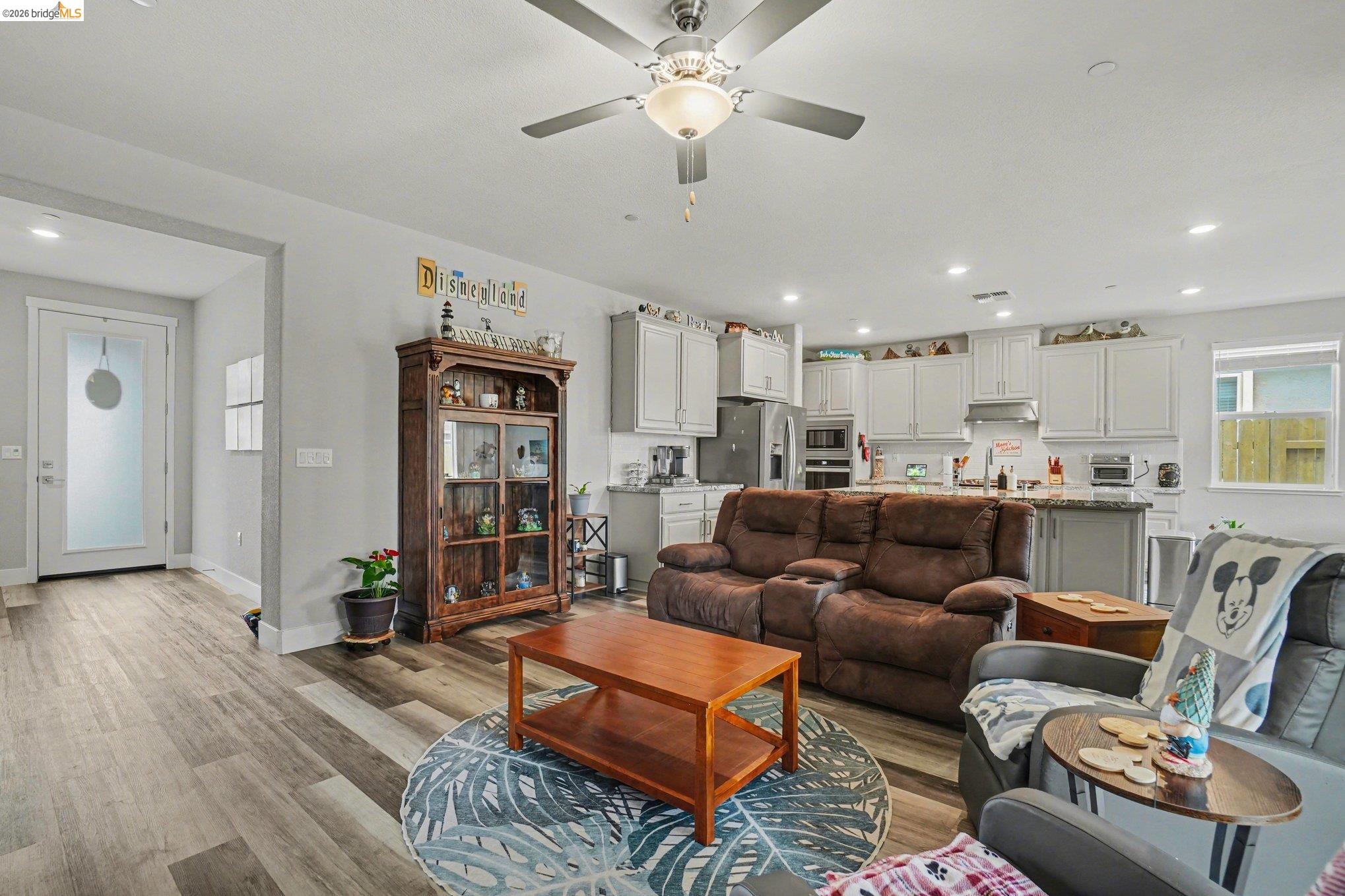 4585 Prairie Path Rio Vista, CA 94571 - Photo 4 of 45 a living room with furniture kitchen view and a chandelier