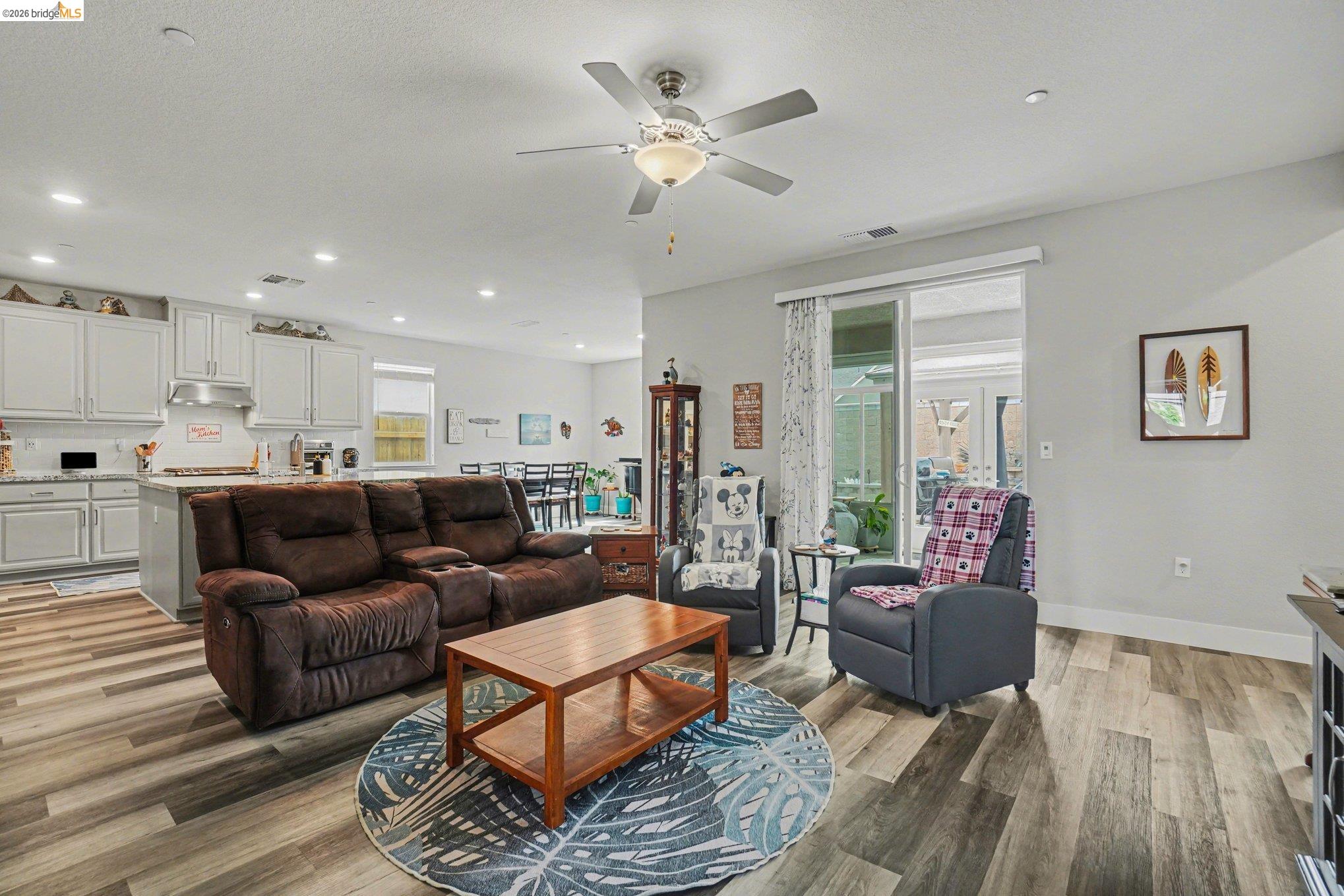 4585 Prairie Path Rio Vista, CA 94571 - Photo 6 of 45 a living room with furniture kitchen view and a chandelier