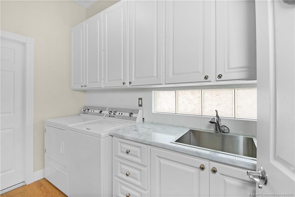 1494 Southwest Balmoral Trace Stuart, FL 34997 - Photo 35 of 45 Laundry Room with Granite Counter
