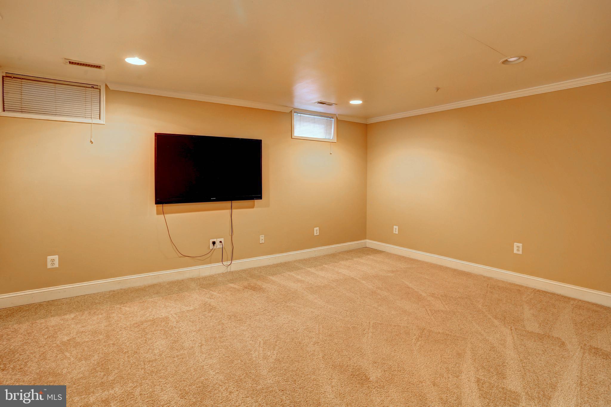6136 Starburn Path Columbia, MD 21045 - Photo 23 of 35 a view of an empty room with a tv