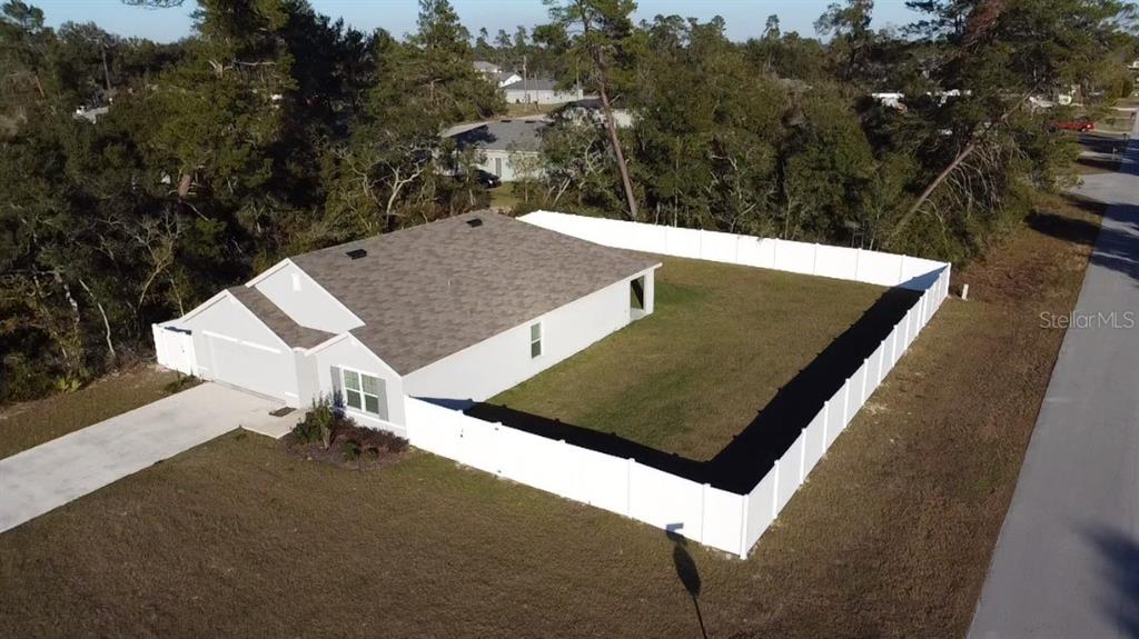 15253 Southwest 28th Avenue Road Ocala, FL 34473 - Photo 11 of 13 an aerial view of a house with a yard