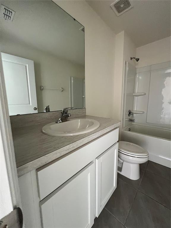15253 Southwest 28th Avenue Road Ocala, FL 34473 - Photo 10 of 13 a bathroom with a sink a toilet and shower