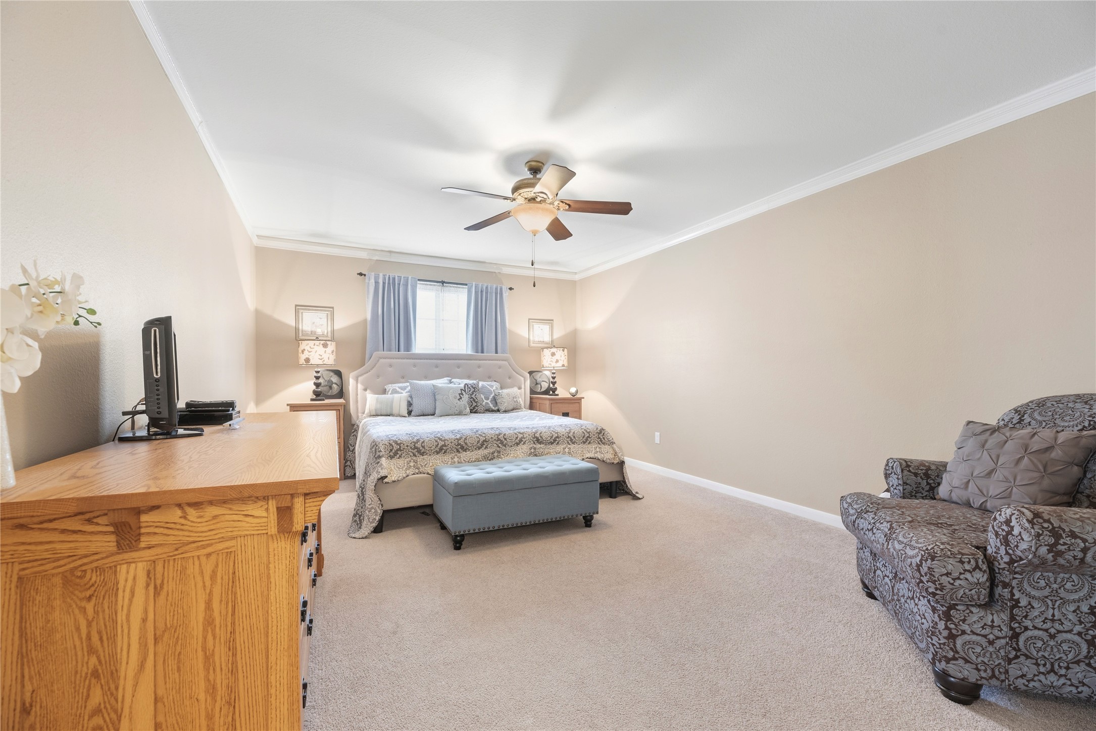 16913 Chapel Pines Drive, Unit 126 Spring, TX 77379 - Photo 19 of 27 This spacious primary bedroom features neutral walls and crown molding.
