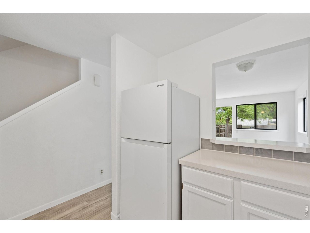724 Mead Street Louisville, CO 80027 - Photo 6 of 38 Kitchen off entry, staircase in background