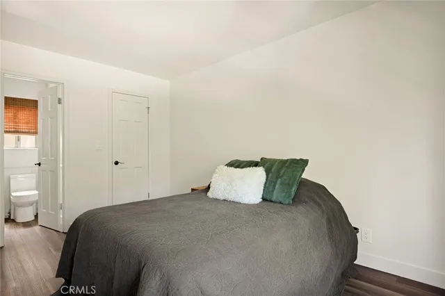 a bedroom with a bed and closet