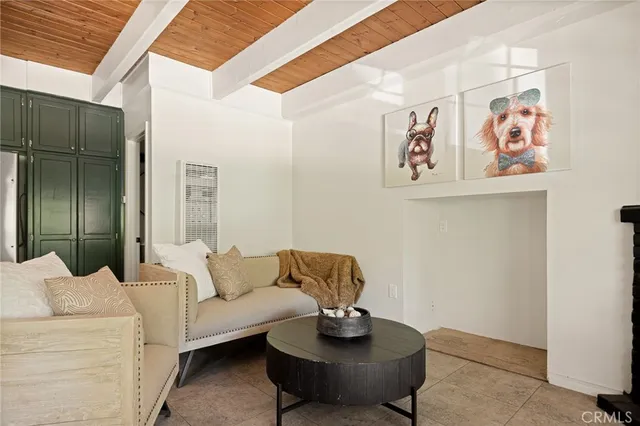 a living room with furniture and wall painting