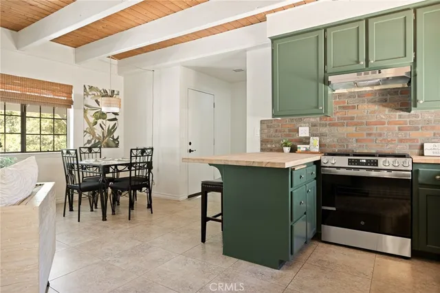 a kitchen with a table and chairs in it