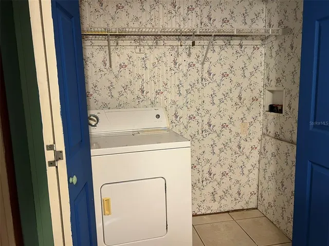 a bathroom with a shower and a sink