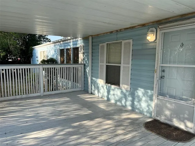 a view of a porch with wooden fence