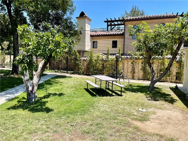 a view of yard along with trees