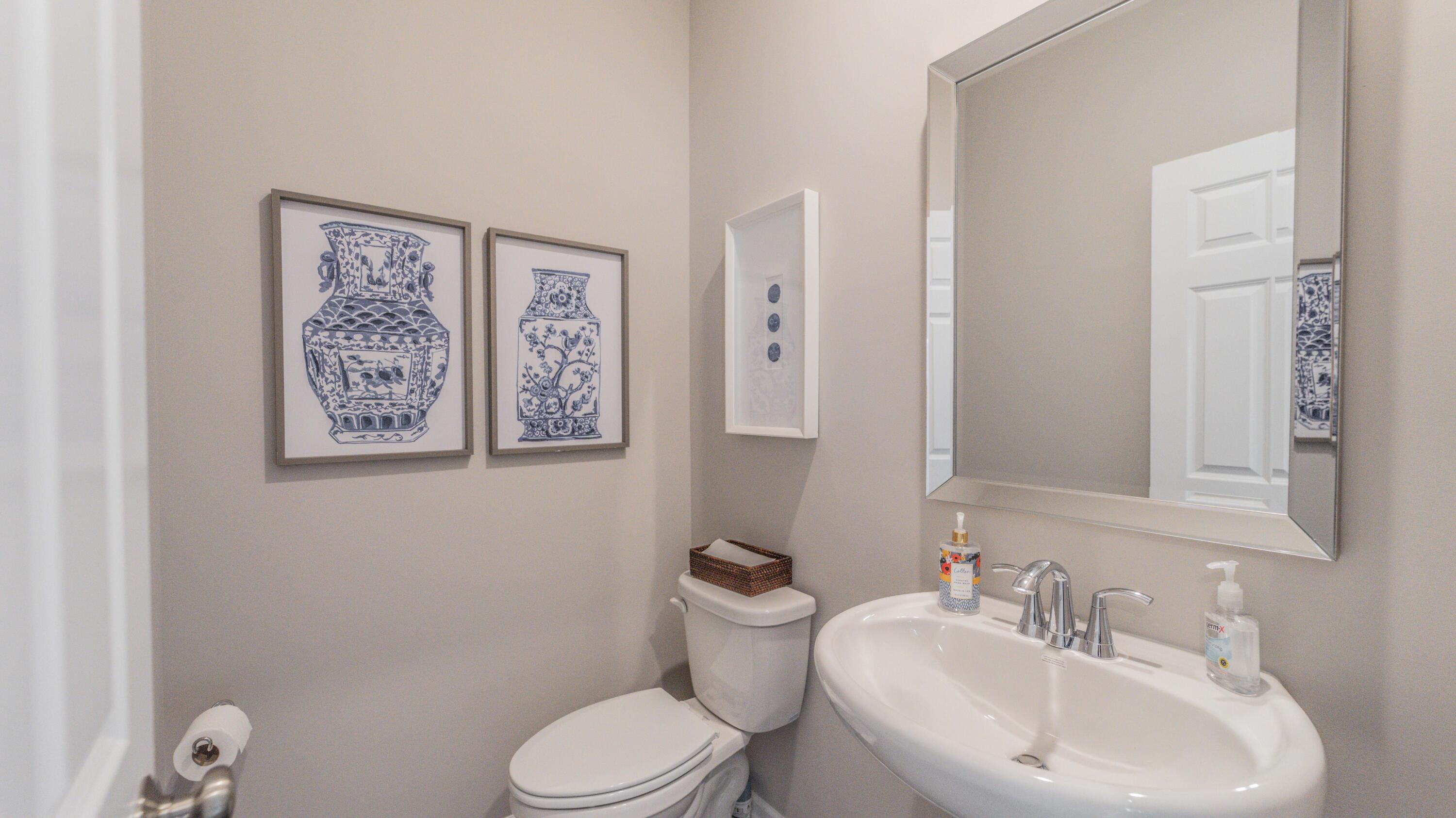 5657 Burr Rdg Circle Crown Point, IN 46307 - Photo 12 of 23 a bathroom with a toilet sink and mirror
