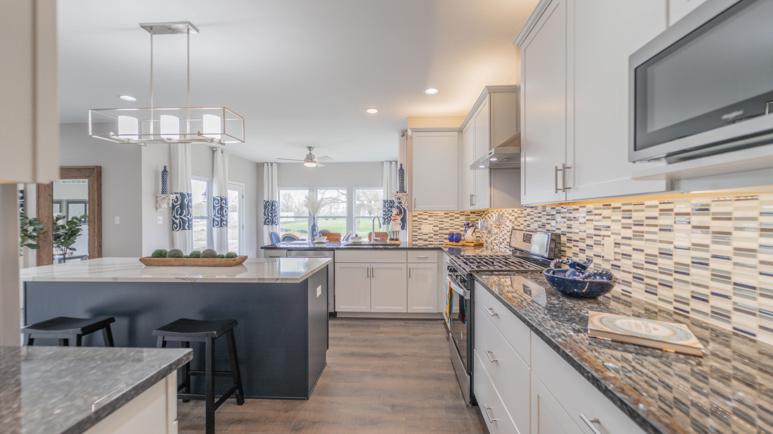 5657 Burr Rdg Circle Crown Point, IN 46307 - Photo 4 of 23 a kitchen with stainless steel appliances granite countertop a sink and cabinets