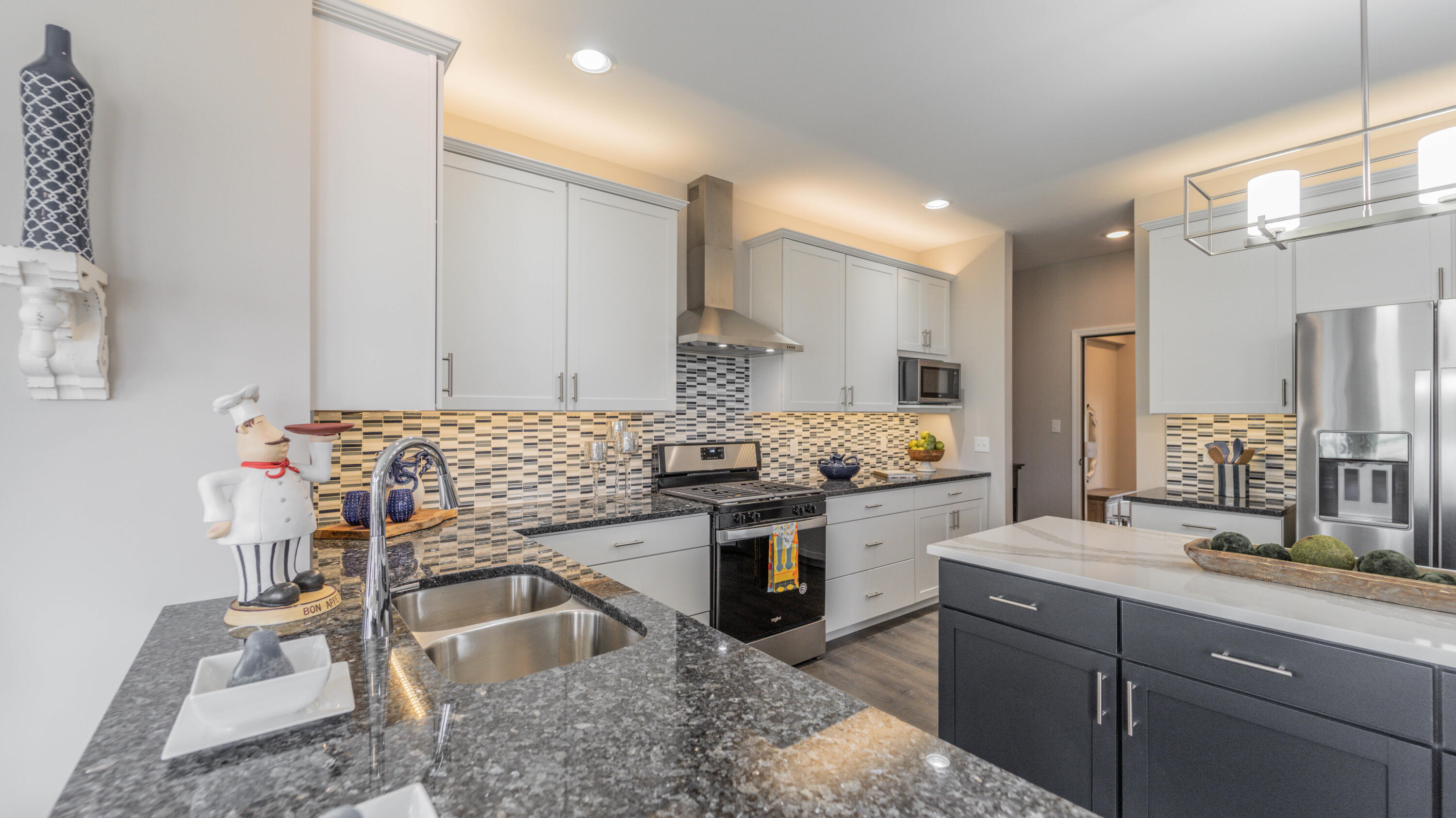 5657 Burr Rdg Circle Crown Point, IN 46307 - Photo 5 of 23 a kitchen with stainless steel appliances granite countertop sink stove and cabinets