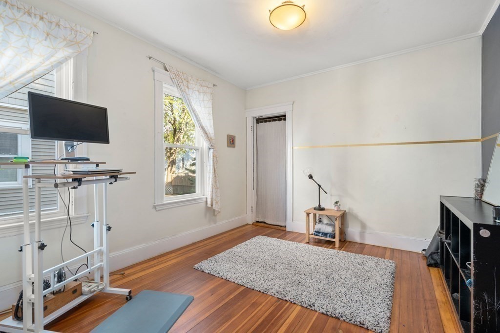89 Bromfield Road Somerville, MA 02144 - Photo 12 of 41 a view of a livingroom with furniture and a flat screen tv