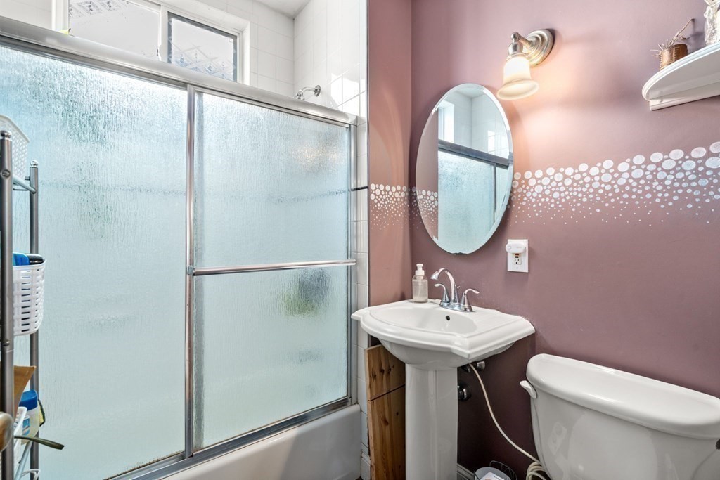 89 Bromfield Road Somerville, MA 02144 - Photo 13 of 41 a bathroom with a sink toilet and a mirror