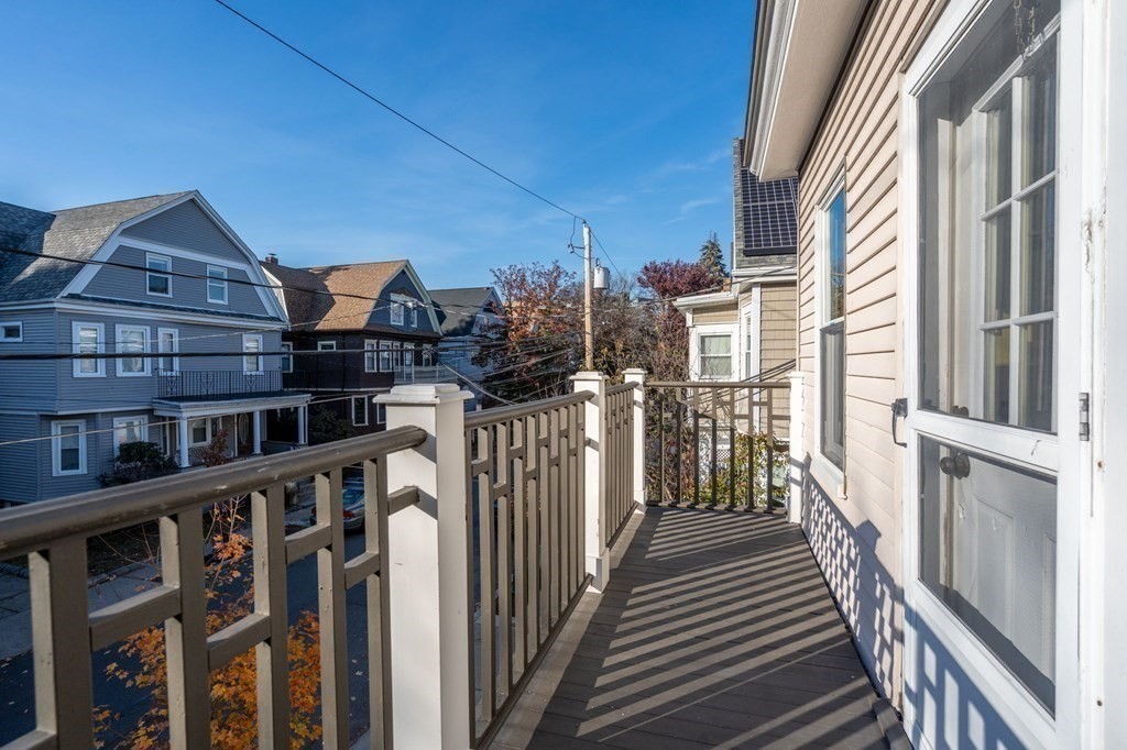 89 Bromfield Road Somerville, MA 02144 - Photo 30 of 41 a view of a house with wooden deck