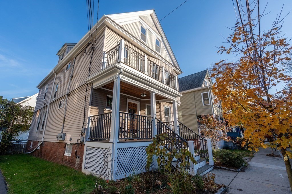 89 Bromfield Road Somerville, MA 02144 - Photo 33 of 41 a view of a building with a yard
