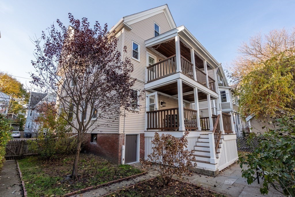 89 Bromfield Road Somerville, MA 02144 - Photo 35 of 41 a front view of a house with a yard