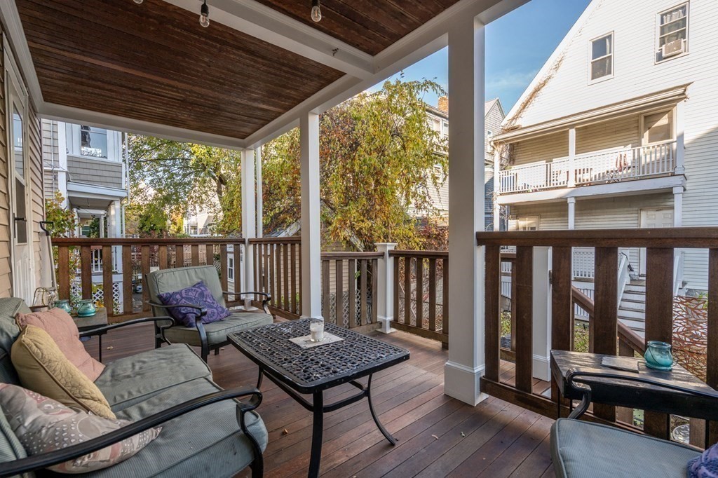 89 Bromfield Road Somerville, MA 02144 - Photo 38 of 41 a outdoor living space with furniture and wooden floor