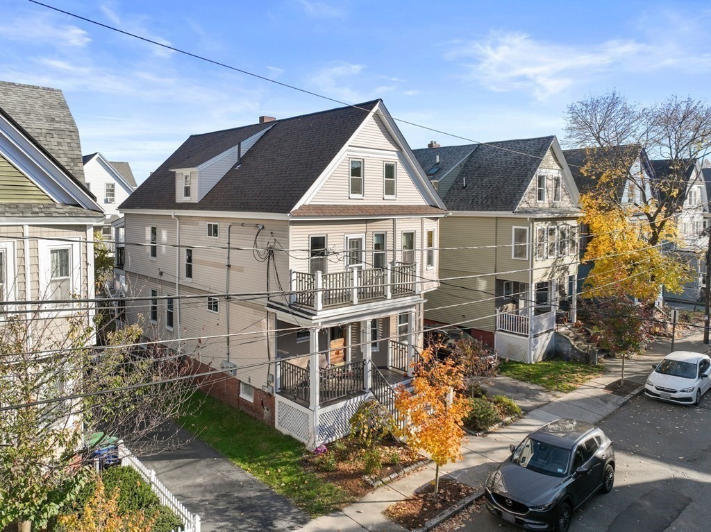 89 Bromfield Road Somerville, MA 02144 - Photo 39 of 41 a view of a big house with wooden fence