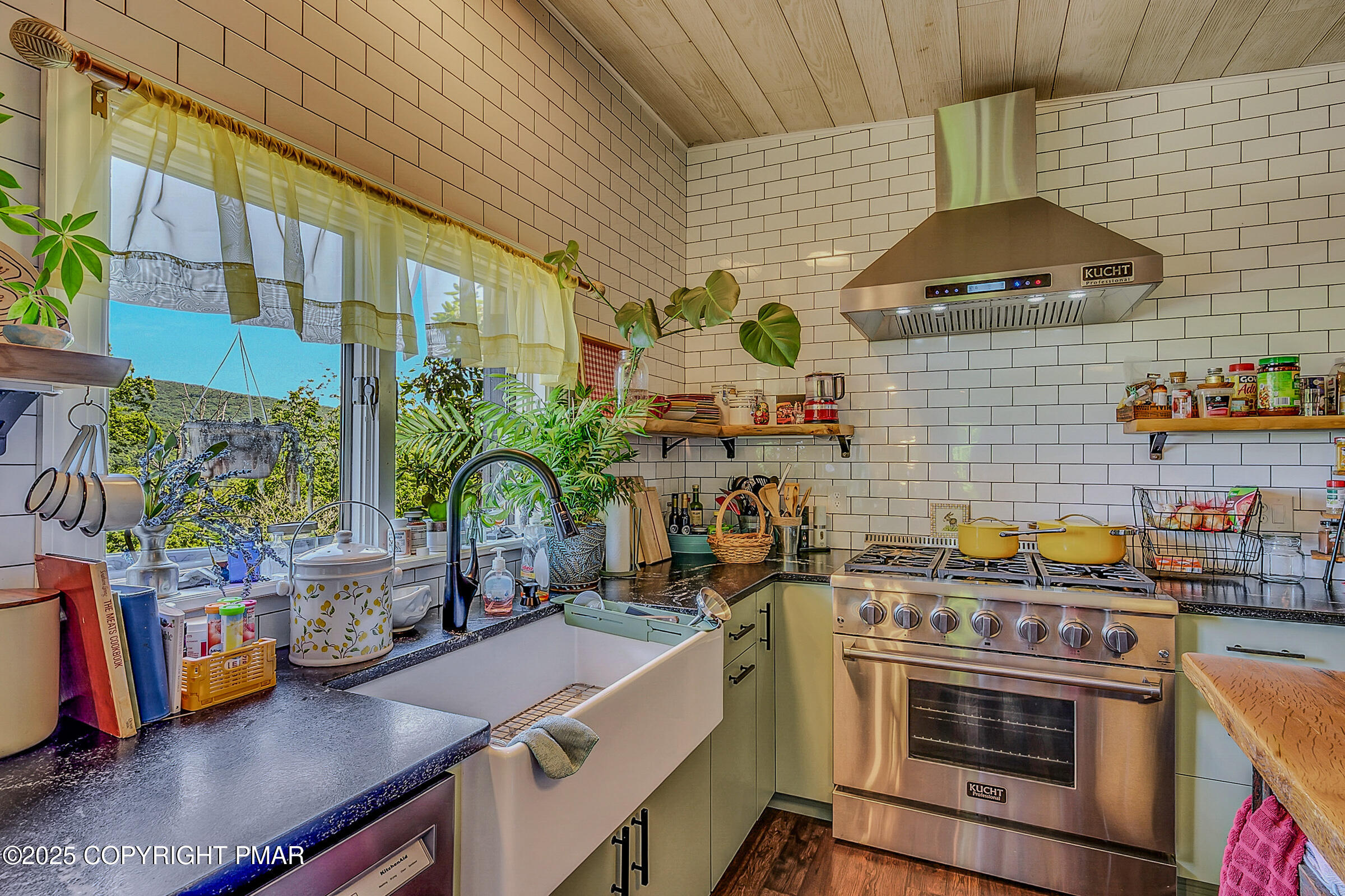261 Hall Lane Tunkhannock, PA 18657 - Photo 12 of 23 a kitchen with stainless steel appliances a stove a sink a counter space and a window