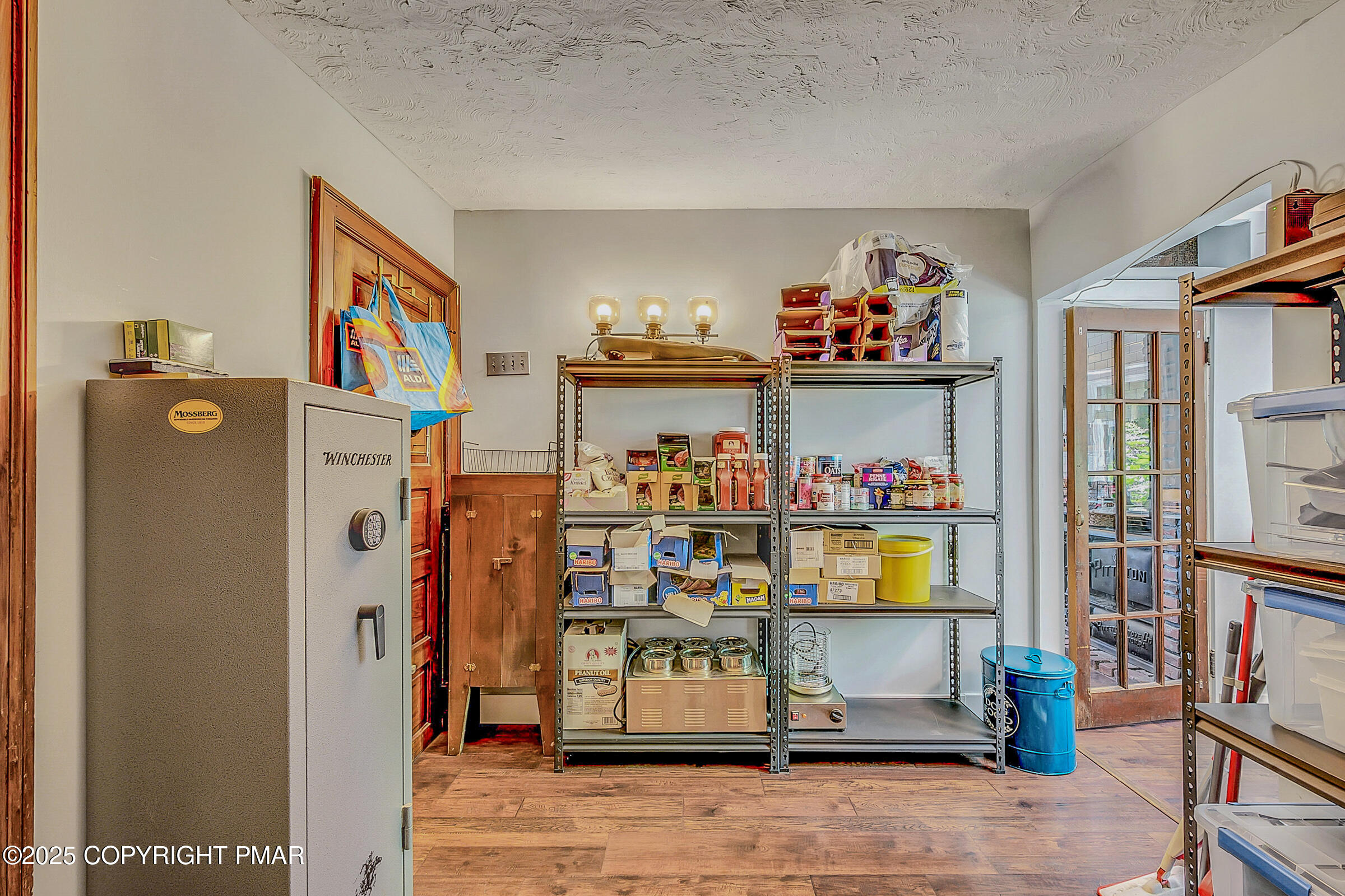 261 Hall Lane Tunkhannock, PA 18657 - Photo 18 of 23 a view of store room with fridge and wall paintings